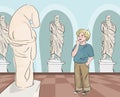 Boy looking at antique statue at museum