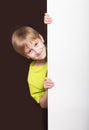 Boy looking around the corner Royalty Free Stock Photo