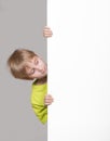 Boy looking around the corner Royalty Free Stock Photo