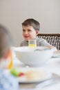 Boy looking away at breakfast table Royalty Free Stock Photo