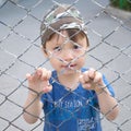 Boy looking through the bars Royalty Free Stock Photo