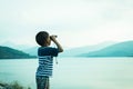 boy looking through binocular nature background,vintage t