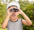 Boy looking through binoculars Royalty Free Stock Photo