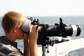 Boy looking through binoculars Royalty Free Stock Photo