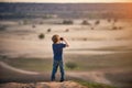 Boy Looking through Binoculars outdoors at sunny day Royalty Free Stock Photo