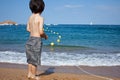 Boy looking at the blue sea Royalty Free Stock Photo