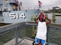 Boy looking at a boat on the hudson river