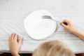 Boy is looking at an empty plate Royalty Free Stock Photo