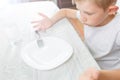 Boy is looking at an empty plate Royalty Free Stock Photo