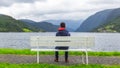 Boy looking at the fjord in Ulvik, Norway Royalty Free Stock Photo