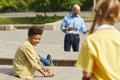 Boy Looking at Friends during Outdoor Lesson Royalty Free Stock Photo