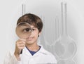 Boy looking through magnifying glass Royalty Free Stock Photo