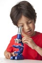 Boy looking through microscope Royalty Free Stock Photo