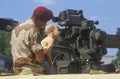 Boy Looking at Military Gun Royalty Free Stock Photo