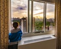 Boy looking at a New York City sunrise Royalty Free Stock Photo