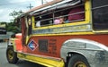 Boy looking out of Jeepney.