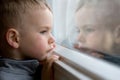 Boy looking out window Royalty Free Stock Photo