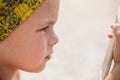 Boy is looking into the phone Royalty Free Stock Photo