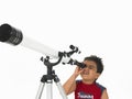 Boy looking through a telescope Royalty Free Stock Photo