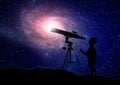 Boy looking through a telescope Royalty Free Stock Photo