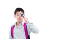 Boy looking thru magnifying glass over white