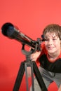 Boy looking thru telescope Royalty Free Stock Photo