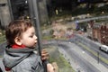 Boy looking at toy city Royalty Free Stock Photo