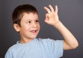 Boy looks at lost tooth Royalty Free Stock Photo