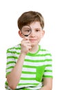 The boy looks through loupe Royalty Free Stock Photo
