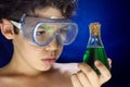 Boy looks scientific experiment Royalty Free Stock Photo