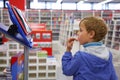 Boy looks at show-windom, bookshop Royalty Free Stock Photo