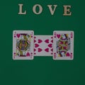 The boy loves the girl, he showers her with hearts. Love is the theme for Valentine`s Day. On a green background