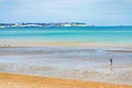 Boy at low tide Sandwich Bay beach Kent England