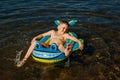 The boy is lying on an inflatable boat Royalty Free Stock Photo