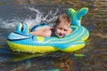 Boy lying on an inflatable rubber mattress on the sea Royalty Free Stock Photo