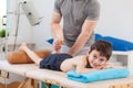 Boy lying on physiotherapy table Royalty Free Stock Photo