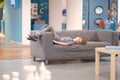 The boy is lying on the sofa Royalty Free Stock Photo