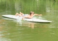 Boy lying on a surf Royalty Free Stock Photo