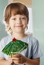 Boy made paper christmas tree Royalty Free Stock Photo