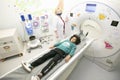 A boy in a magnetic resonance imaging machine in a hospital