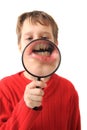 Boy and magnify glass Royalty Free Stock Photo