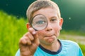 Boy with a magnifying glass Royalty Free Stock Photo