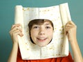 Boy make fun cut hole in pita thin bread Royalty Free Stock Photo