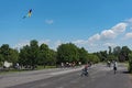 Boy makes a kite climb on the nature and recreation area. Old airfield in Frankfurt-Bonames