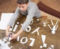 Boy makes origami - car and family, children, parent, I love you text, top view on wood background Royalty Free Stock Photo