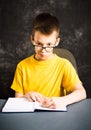 Boy making faces while studying Royalty Free Stock Photo