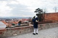 Boy making photo by phone at historical Mikulov Castle, Moravia, Czech Republic. Old European town