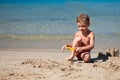 Boy making sand castle on beach Royalty Free Stock Photo
