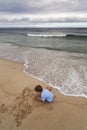 Boy making a sandcastle Royalty Free Stock Photo