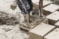 Boy making traditional adobe mud bricks in Paru Paru Community